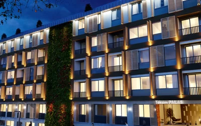 exterior-view-of-the-residential-building-project-having-a-modern-architecture-with-artificial-grass-decoration-and-evening-time-background