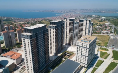 four-high-rise-residences-and-a-luxurious-building-with-numerous-commercial-units-next-to-road-with-sea-and-greenery-view-windows